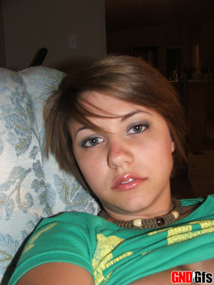 Young amateur model Babette displaying freshly shaved cunt after undressing
